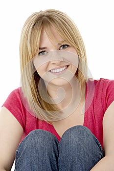 Studio Portrait Of Smiling Teenage Girl