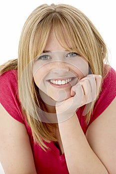 Studio Portrait Of Smiling Teenage Girl