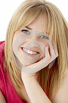 Studio Portrait Of Smiling Teenage Girl