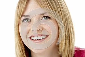 Studio Portrait Of Smiling Teenage Girl