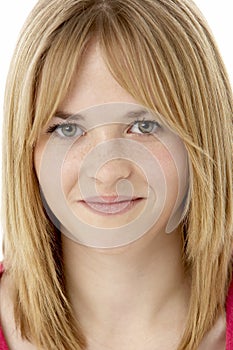 Studio Portrait Of Smiling Teenage Girl