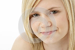 Studio Portrait Of Smiling Teenage Girl