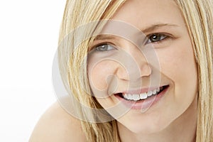 Studio Portrait Of Smiling Teenage Girl