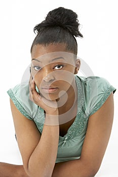 Studio Portrait Of Smiling Teenage Girl