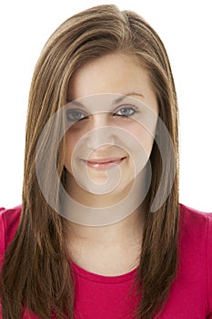 Studio Portrait Of Smiling Teenage Girl