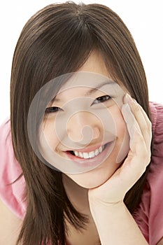 Studio Portrait of Smiling Teenage Girl