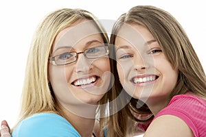 Studio Portrait of Smiling Teenage Girl with older