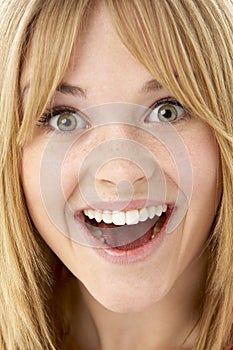 Studio Portrait Of Surprised Teenage Girl