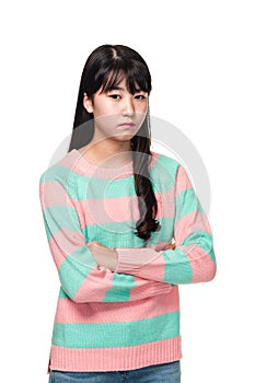 Studio portrait of a teenage East Asian woman with arms folded