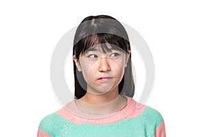 Studio portrait of a teenage East Asian woman looking sideways