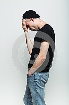 Studio portrait of thoughtful man.