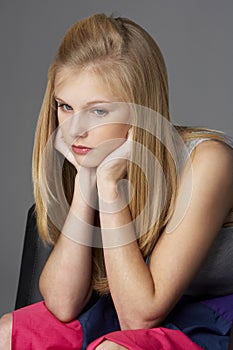 Studio Portrait Of Unhappy Teenage Girl