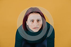 Studio portrait of unhappy young woman. Anger, Anxiety, Bipolar disorder