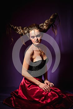 Studio portrait of woman in halloween makeup, on black background