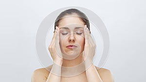 Studio portrait of young, beautiful and natural blond woman applying skin care cream. Face lifting, cosmetics and make