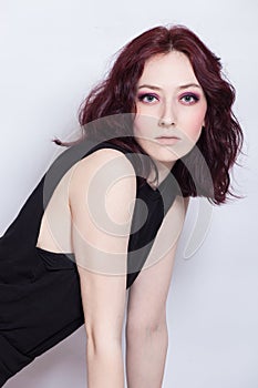 Studio portrait of young blue eyes woman with pale complexion