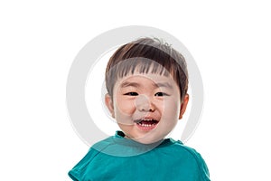 Studio portrait of young child building smile in white background