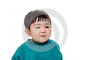 Studio portrait of young child building smile in white background