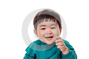 Studio portrait of young child building smile in white background