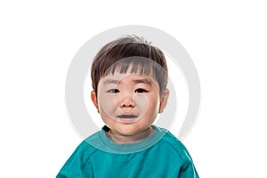 Studio portrait of young child building smile in white background