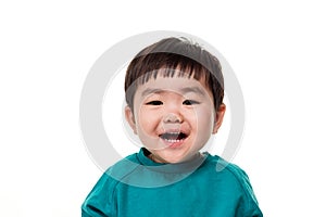 Studio portrait of young child building smile in white background