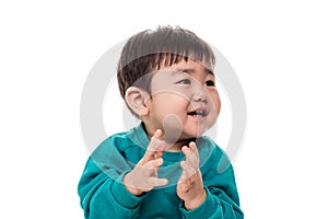 Studio portrait of young child building smile in white background