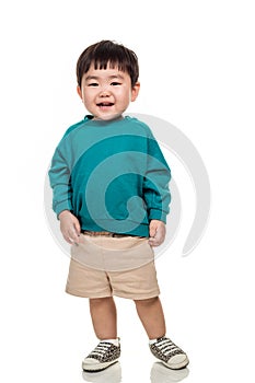 Studio portrait of young child building smile in white background