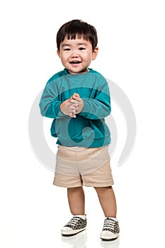 Studio portrait of young child building smile in white background
