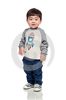 Studio portrait of young child building smile in white background