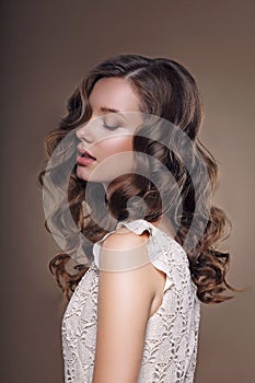 Studio Portrait of Young Dreamy Brunette with Closed Eyes