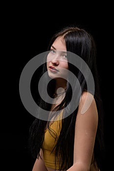 studio portrait of a young girl in torn jeans 2