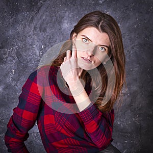 Studio portrait of young longhaired beautiful woman.