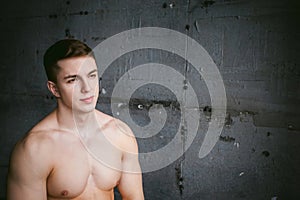 Studio portrait young men bodybuilder athlete, with a bare torso