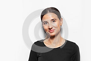 Studio portrait of young smiling girl on white background.