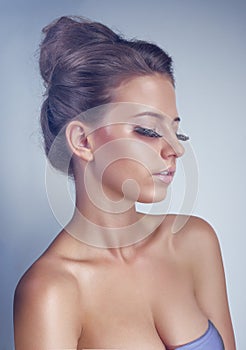 Studio portrait of young woman with long eyelashes