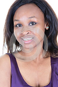 Studio portrait of a young woman smiling from american african origin