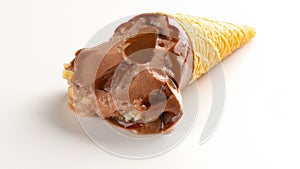 Studio shoot of mini size chocolate flaovr ice cream cone melting close up time lapse