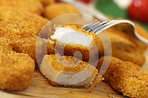 Studio shooting of a fried chicken pieces (nuggets