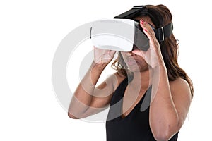 Studio shot of african american woman wearing virtual reality goggles watching movies playing video games