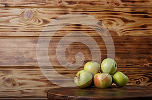 studio shot of apples on wooden background