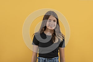 Studio shot of an attractive teenager girl with braces wearing  black shirt