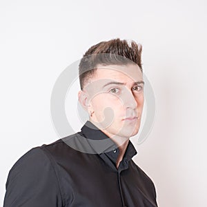 Studio shot of an attractive youg professional looking at camera. White background