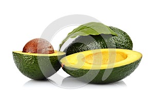 Studio shot of avocado with leaf and pit core isolated