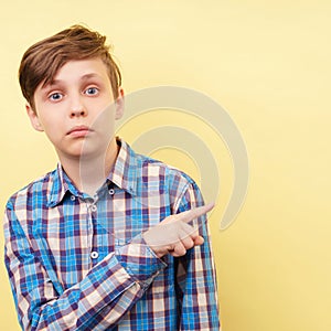 Studio shot of boy with surprised face expression