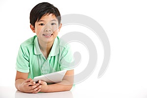 Studio Shot Of Chinese Boy With Digital Tablet