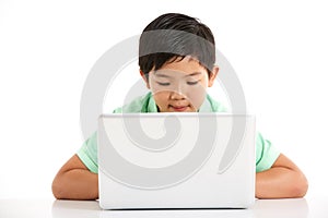 Studio Shot Of Chinese Boy With Laptop