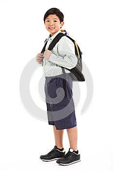 Studio Shot Of Chinese Boy In School Uniform