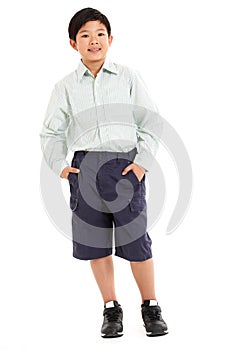 Studio Shot Of Chinese Boy In School Uniform