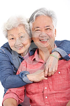 Studio Shot Of Chinese Senior Couple