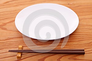 Empty Japanese dish with chopsticks